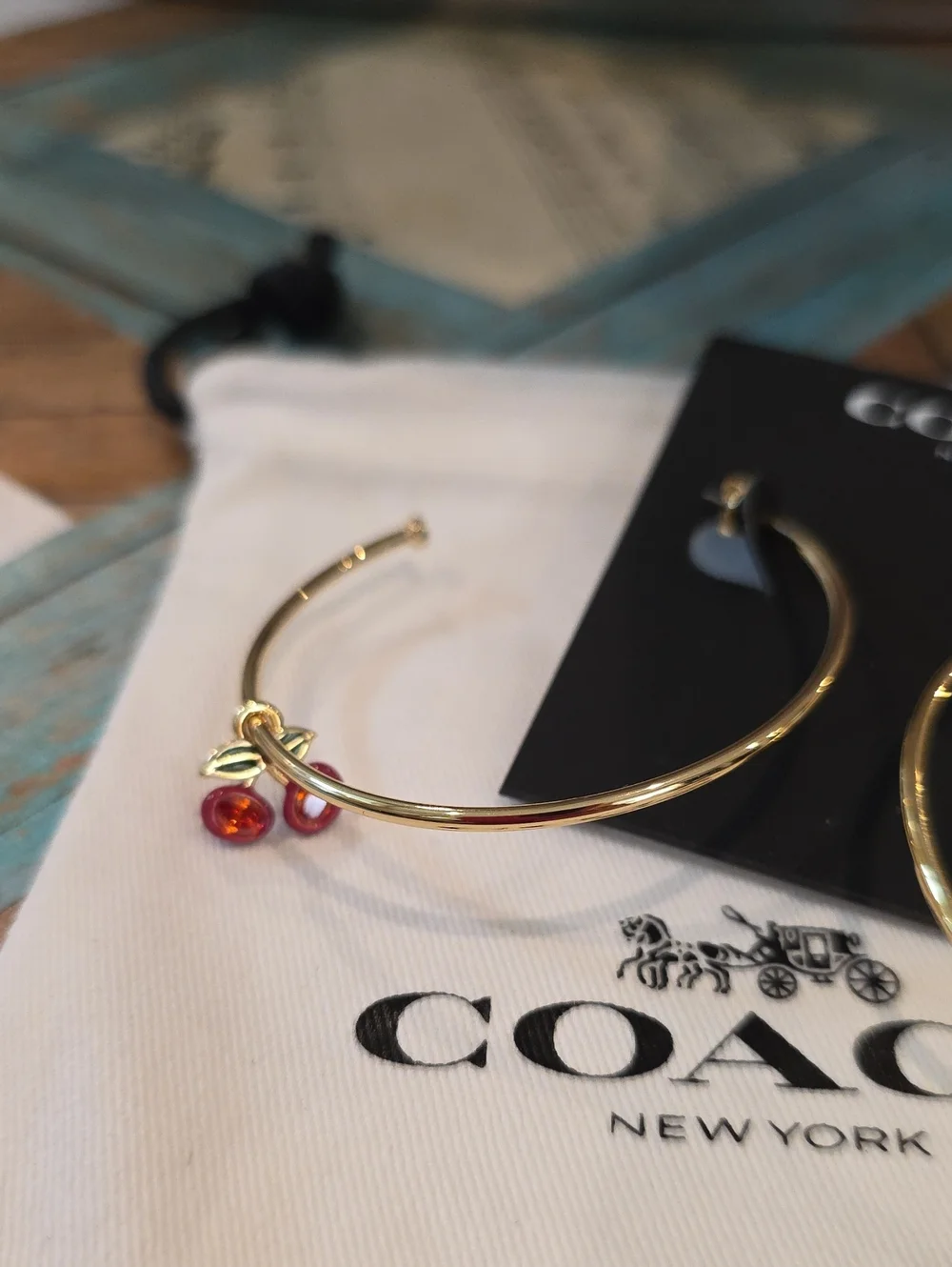 Coach gold tone